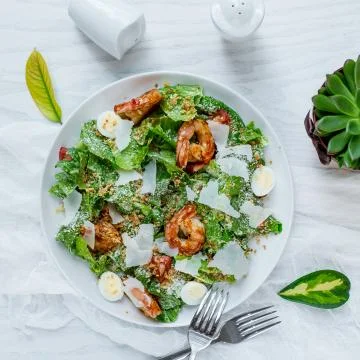 Shrimp ceasar salad on the table Stock Photos