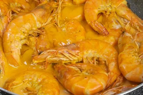 Shrimp cooked in curry and coconut milk, close-up Stock Photos