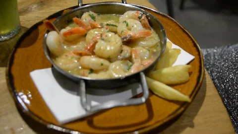 Shrimp delicious stew served in small pan. shrimps in cream sauce dish in a rest Stock-Footage 101665483