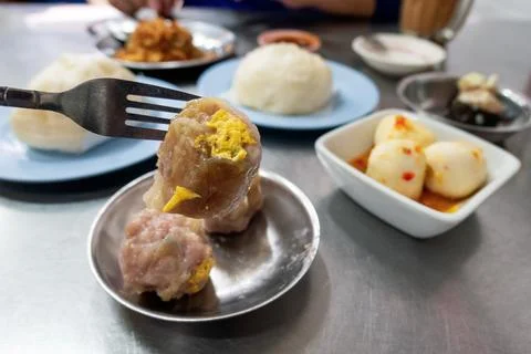 Shrimp dumpling on fork in restaurant Stock Photos