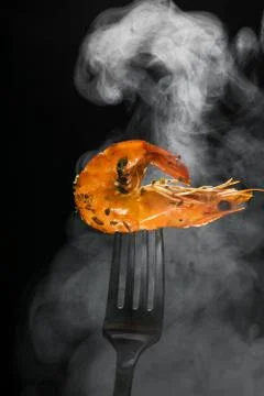 Shrimp on a fork Stock Photos