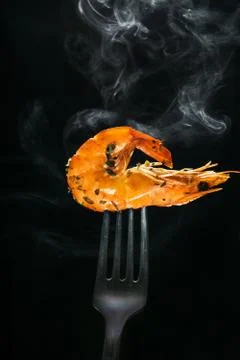 Shrimp on a fork Stock Photos