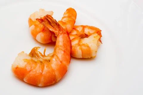 Shrimp fried in oil laid out on a white plate Stock Photos