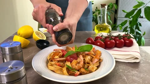 Shrimp pasta. Composition with cherry tomatoes, lemons, olive oil and pepper Stock Footage 155152198
