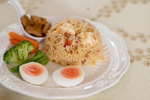 Shrimp paste chili paste fried rice with fresh boiled egg on food and drink.. 写真素材