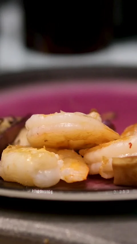 Shrimp plate chopsticks taking portion of sushi roll on the table restaurant Stock Footage 306931961
