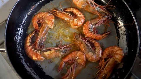 Shrimps being seared in pan Stock Footage 128569236