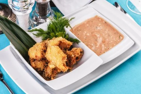  Shrimps, cleaned without shell, fried in batter, beer snack with creamy mustard Stock Photos