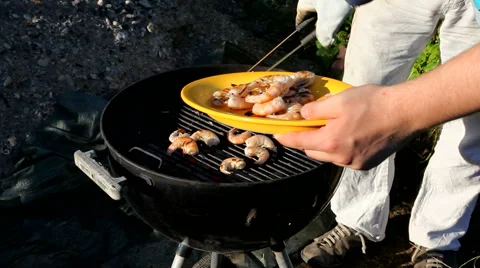 Shrimps on the grill - getting turned Stock Footage 40254835