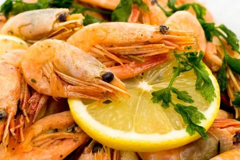 Shrimps with lemon slice Stock Photos