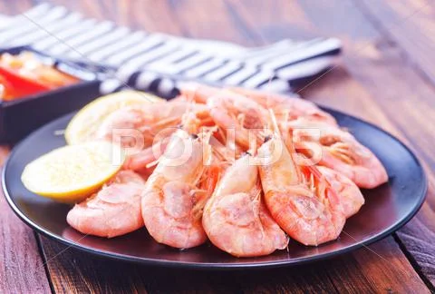 Shrimps on plate on a table Stock Photos