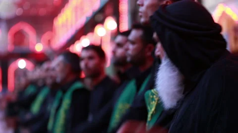 Shrine's servants mourning for Imam Hussein inside Hussein's shrine, Karbala 793 Video stock 45162828