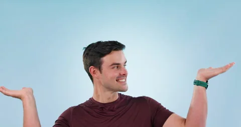 Shrug, doubt and face of man in a studio with a choice, balance or choice or Vidéo 253863592