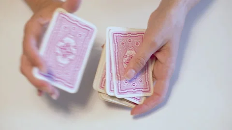 Shuffle cards with two hands to play a game Stock Footage 153667201