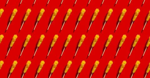 Shugar yellow candy seamless pattern flat lay on red background. Christmas, new Stock Photos