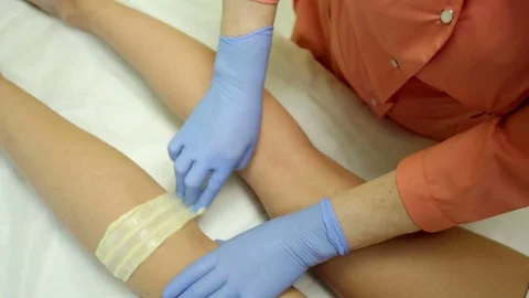 Shugaring master performs the procedure Stock Footage 79603559