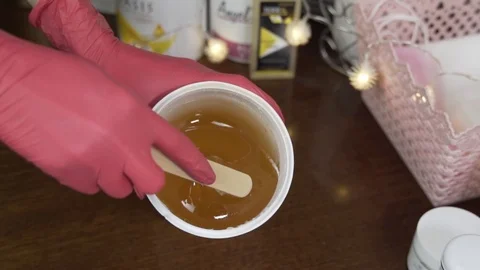 Shugaring paste in box. slow motion Stock Footage 124498621