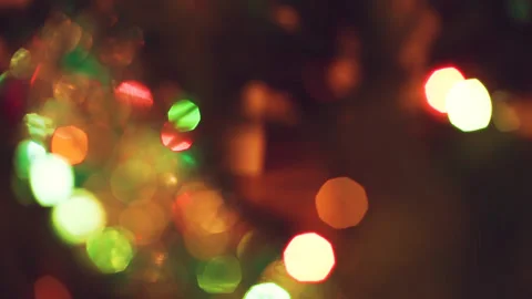Shuning blurry deep bokeh Christmas tree decoration and shimmery garland lights Stock Footage 145956314