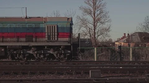 The shunting train drives past the station. From left to right Stock Footage
