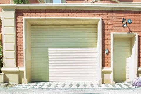 Shutter door or roller door and concrete floor outside .White Automatic shutt Foto stock