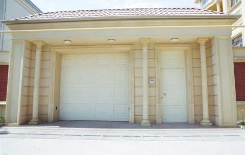 Shutter door or roller door and concrete floor outside .White Automatic shutt Stock Photos