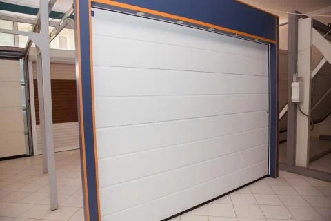 Shutter door or roller door and concrete floor outside .White Automatic shutt Stock Photos