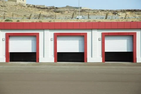 Shutter door or roller door and concrete floor outside .White Automatic shutt Stock Photos