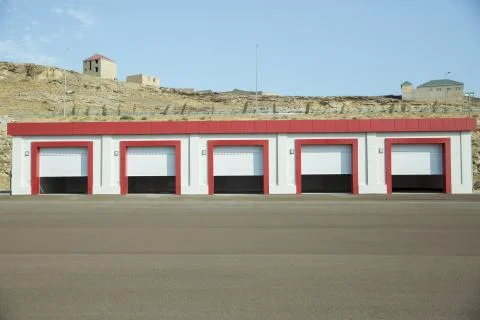 Shutter door or roller door and concrete floor outside .White Automatic shutt Stock Photos