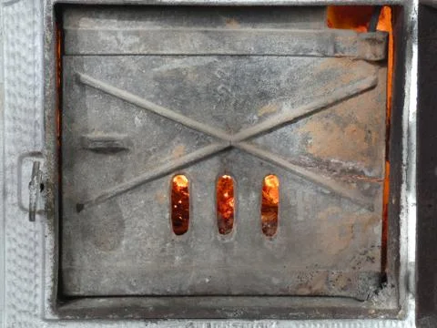 Shutter of Old Tile Stove - Fire Inside Stock Photos
