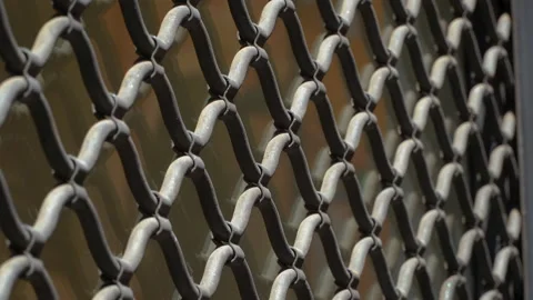 Shutter in the shop window. Iron grating sloping down on the shop window.  Video stock 201121876