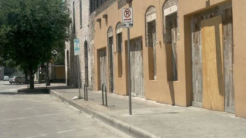 Shuttered storefront during the covid-19 coronavirus pandemic Stock Footage 129578683