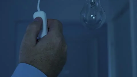 Shutting the Light from the Switch in the Office. One Person Turning Off the Stock Footage 312120126