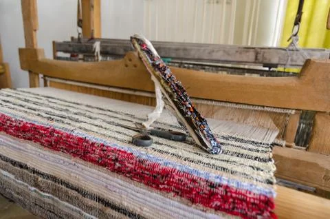 Shuttle on the antique loom and thread Stock Photos
