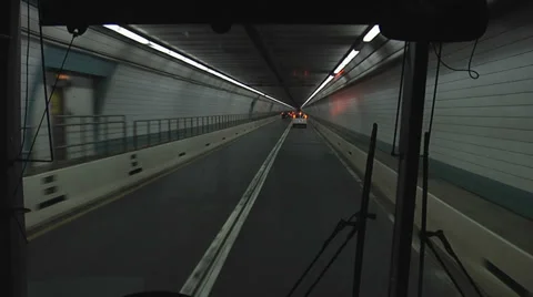 SHUTTLE BUS DRIVING THROUGH TUNNEL Video stock 37169634
