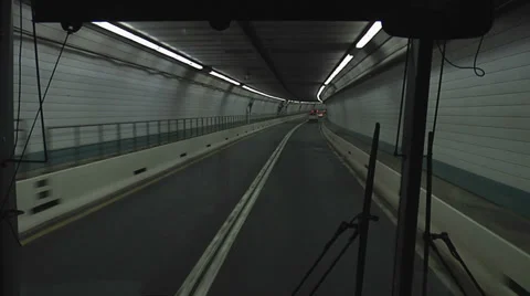 SHUTTLE BUS DRIVING THROUGH TUNNEL Video stock 37169928