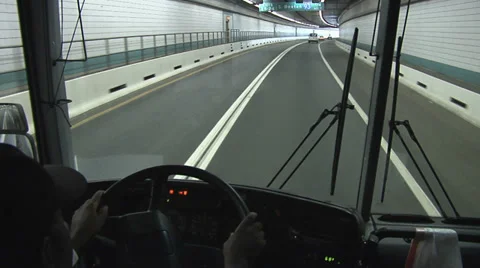 SHUTTLE BUS DRIVING THROUGH TUNNEL Video stock 37169948