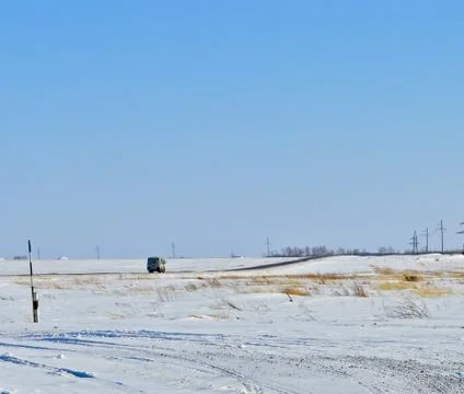 Shuttle bus on a winter road Stock Photos