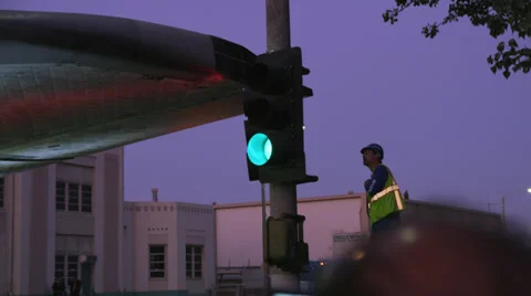 Shuttle Endeavor crosses intersection worker checks clearance HD Video stock 39568007