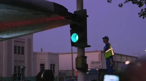Shuttle Endeavor crosses intersection worker checks clearance 4K Stock Footage 39569587