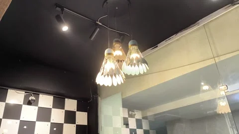 Shuttle Shaped Wall Light Illuminating a Modern Shop Interior, 13/9/2026, Isb Stock Footage 345439283