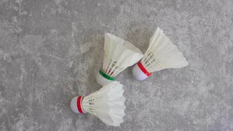 Shuttlecock on abstract gray background Video stock 336907024
