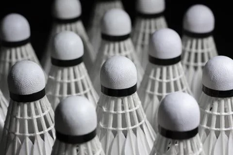 Shuttlecock on a black background. Stock Photos