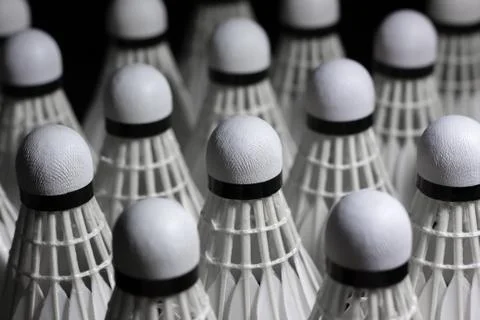 Shuttlecock on a black background. Stock Photos