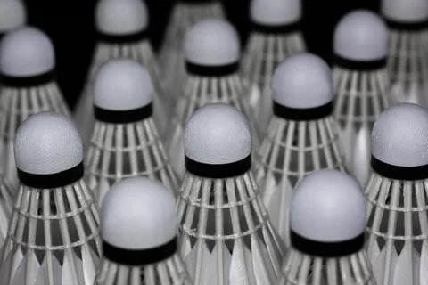 Shuttlecock on a black background. Stock Photos