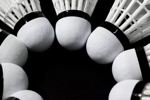Shuttlecock on a black background. Stock Photos