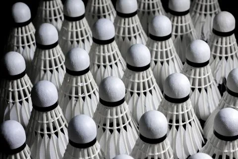 Shuttlecock on a black background. Stock Photos