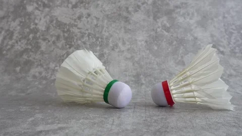 Shuttlecock falling on abstract gray background Stock Footage 336951222