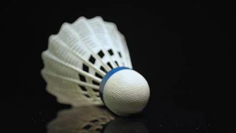 Shuttlecock falling in slow motion close up and black background. Badminton.. Video stock 271096500