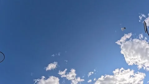 Shuttlecock flying high in clear blue sky Stock Footage 320259396