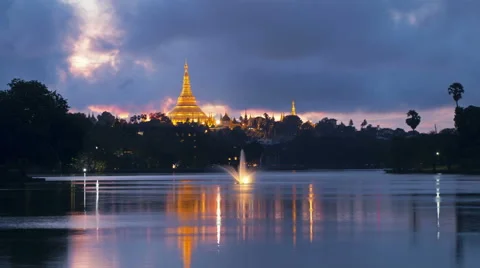 Shwedagon Pagoda Yangon Myanmar Day To Night Timelapse With Lake Reflection Stock Footage